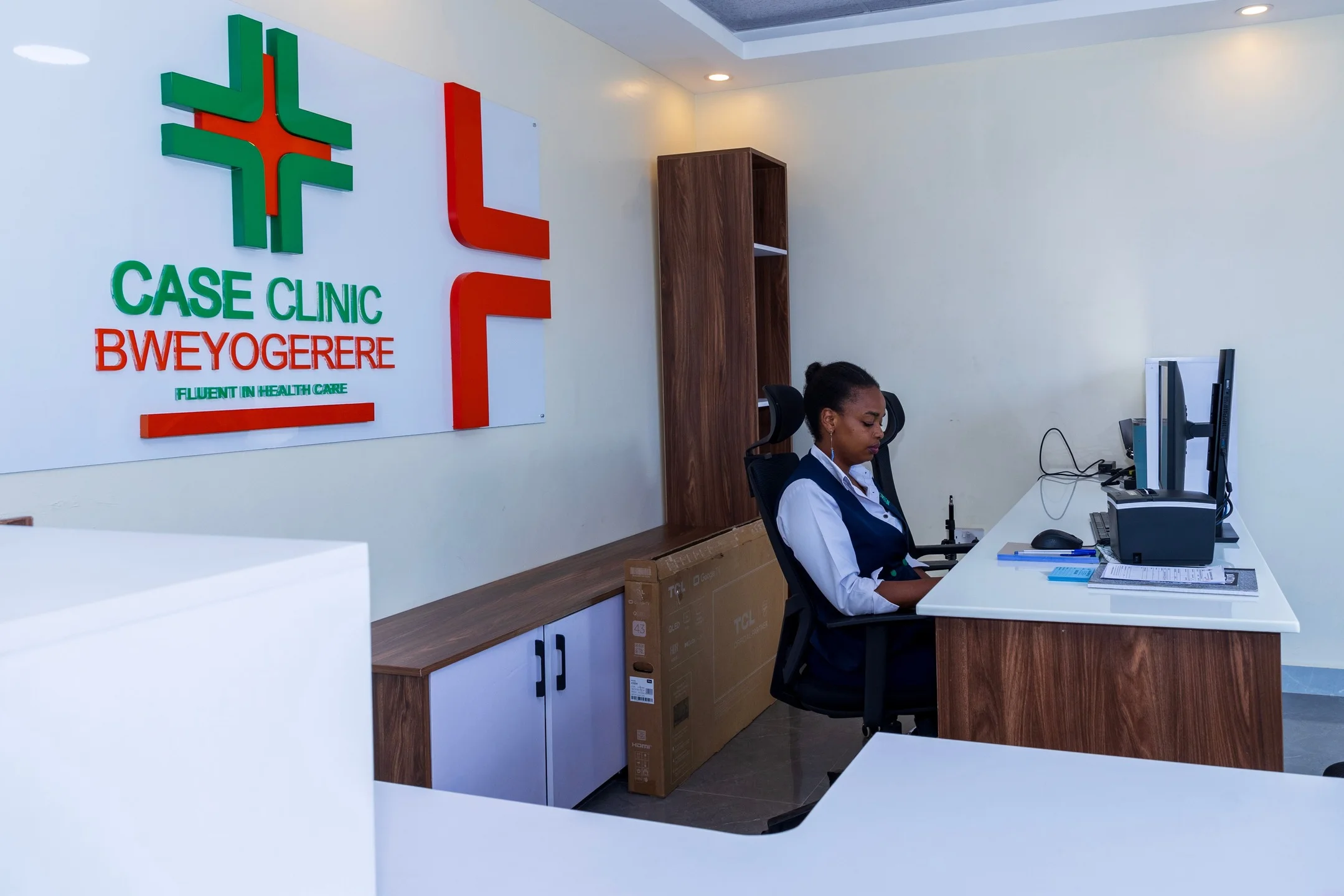 Healthcare worker at Case Clinic Bweyogerere drawing blood from a patient
