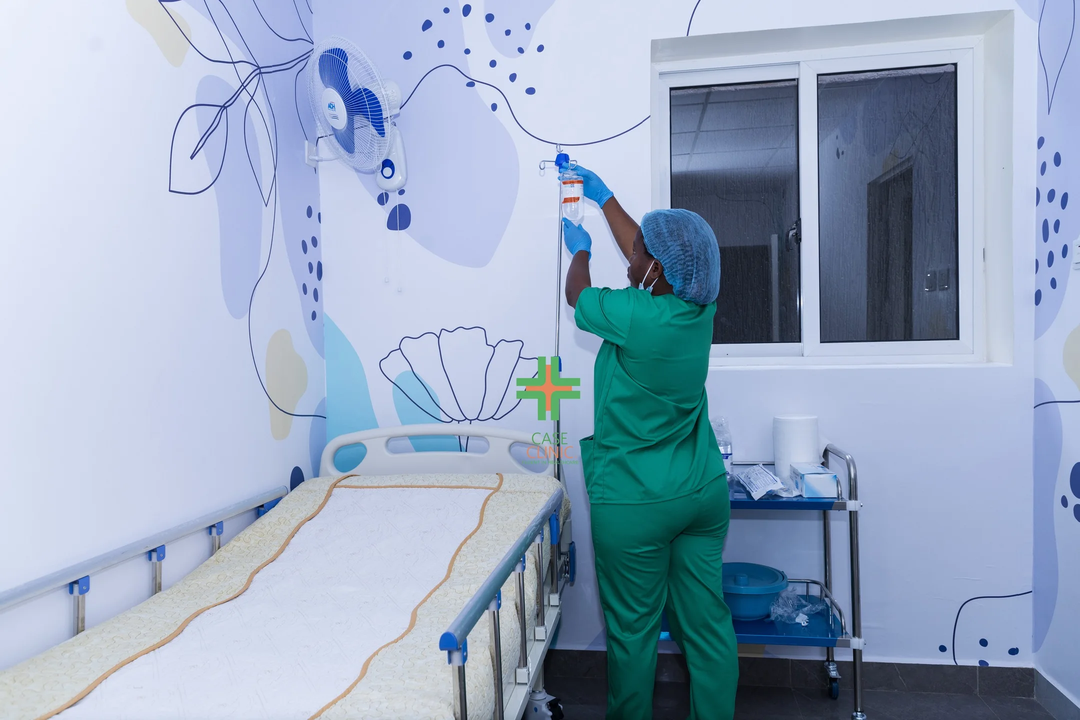Nurse at Case Clinic Bweyogerere administering IV treatment