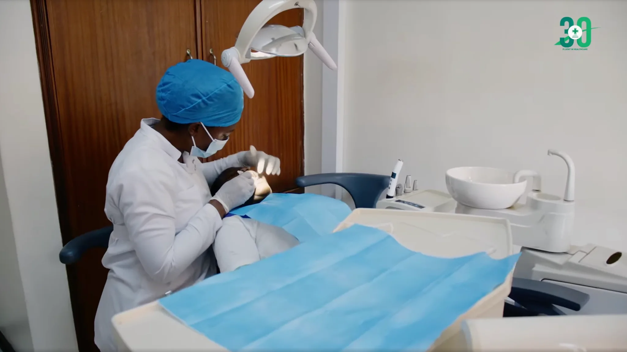 Case dental clinician performing an oral examination