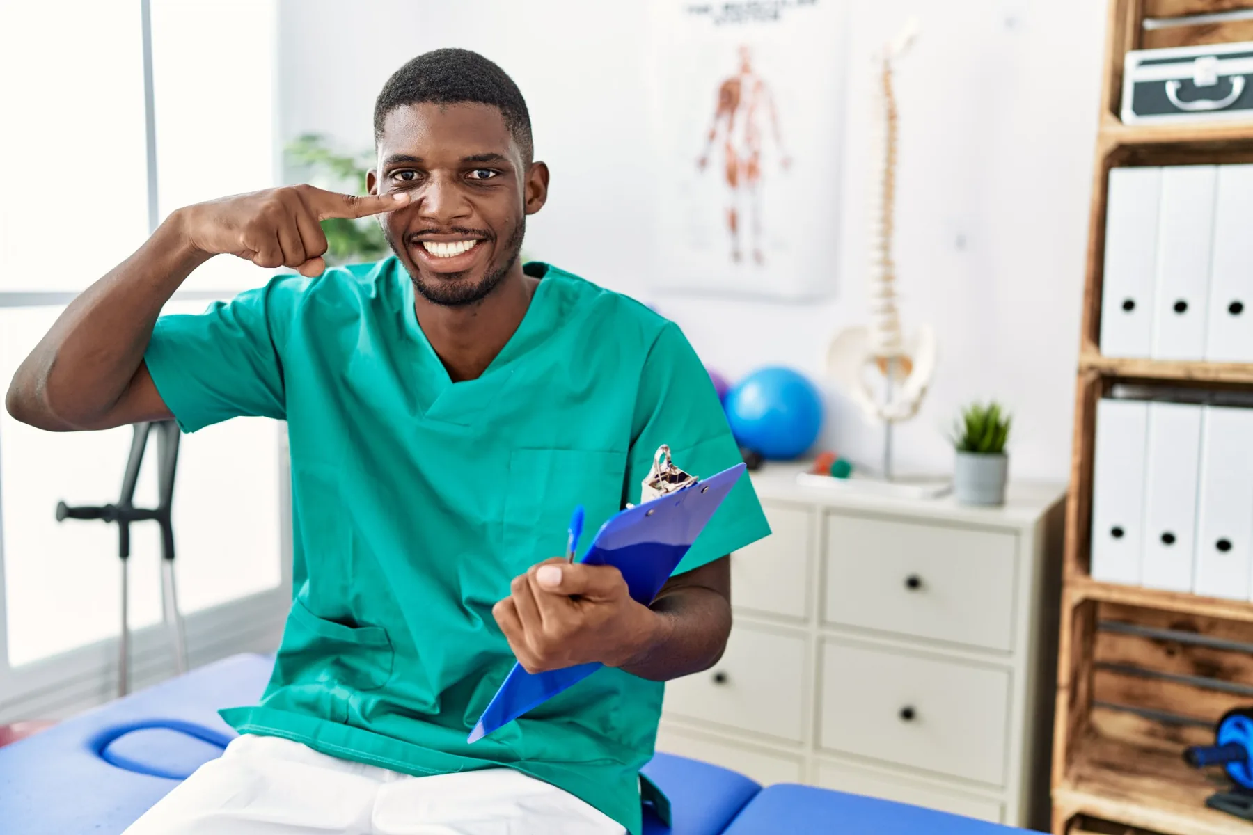 Orthopaedics rehabilitation clinician supporting a patient